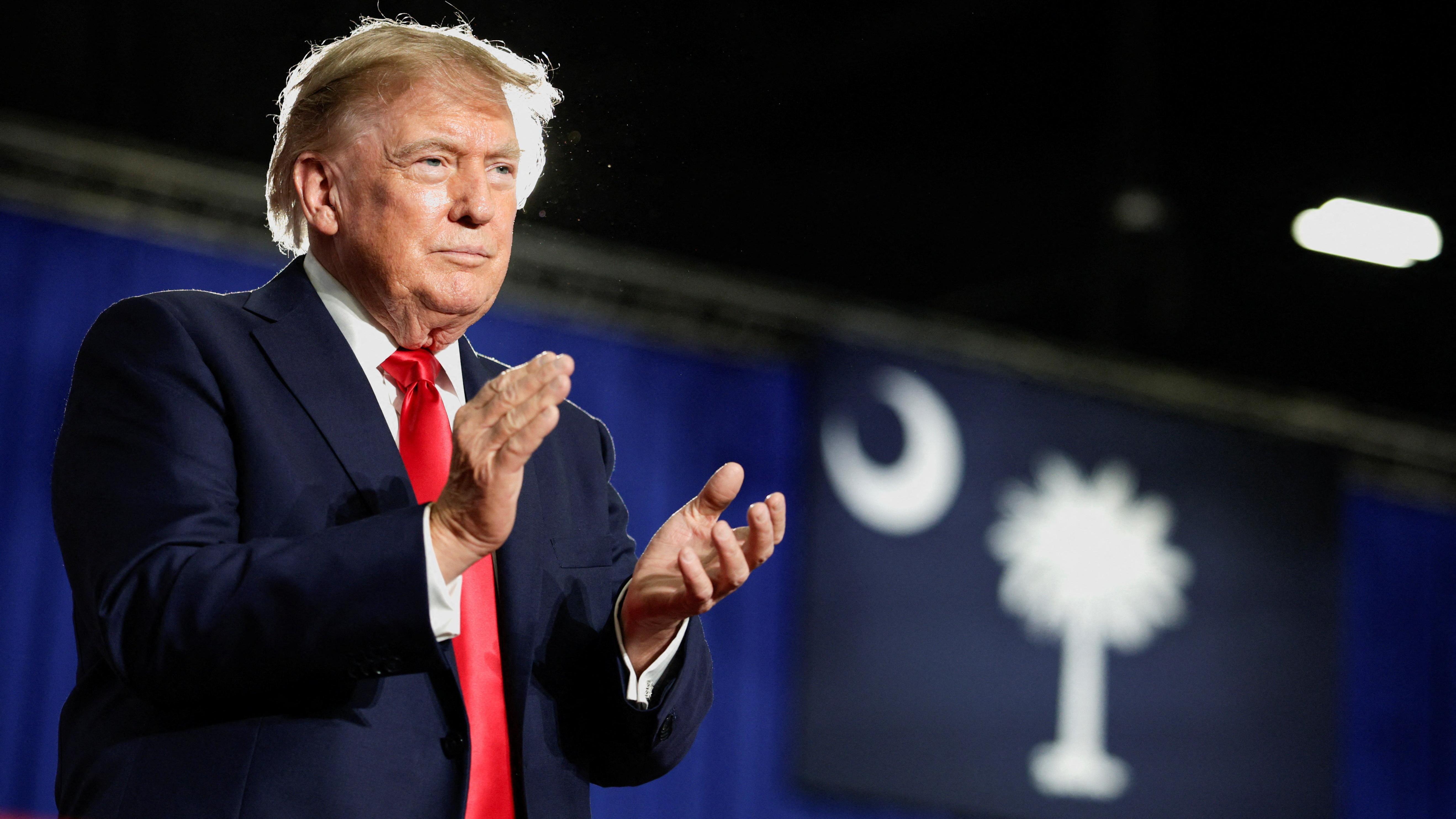 Trump says Canada wants 'benefits' of being US state as Carney says countries in trade war