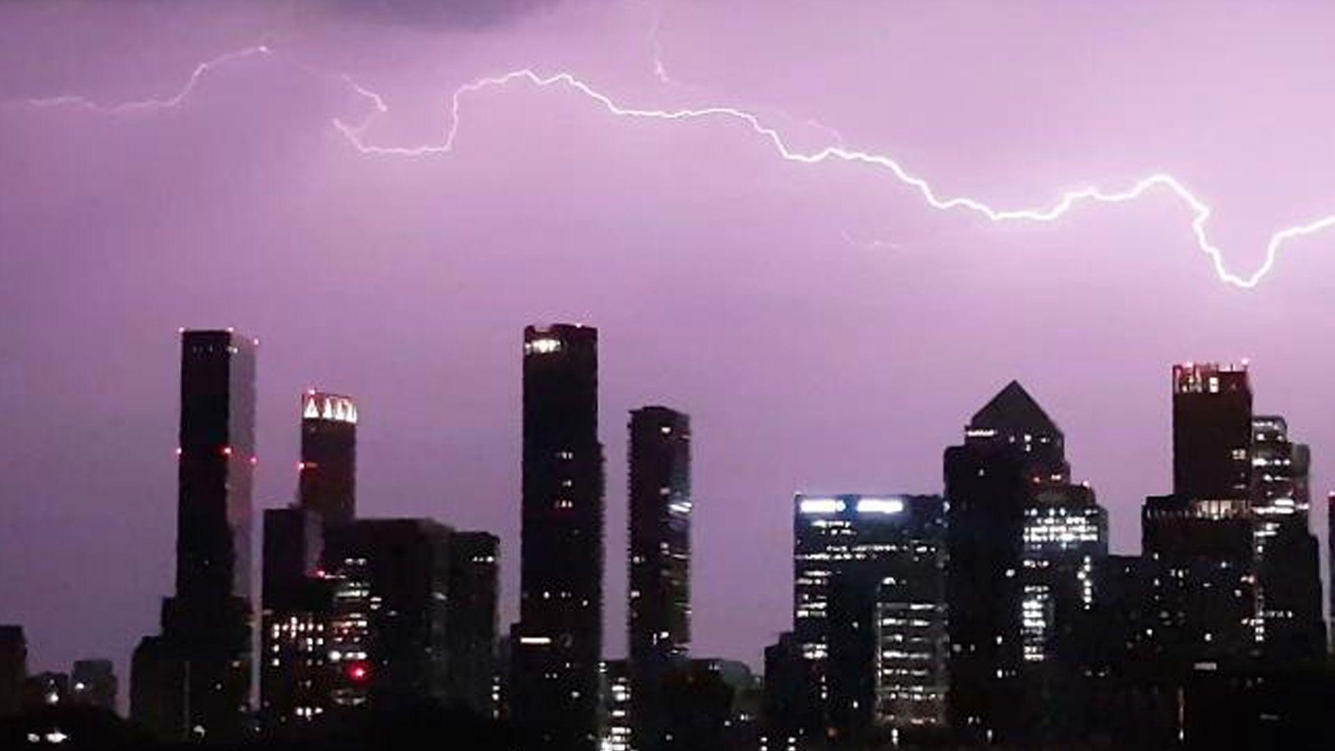 Floods, fires and travel disruption after overnight storms, as UK set for record June heat