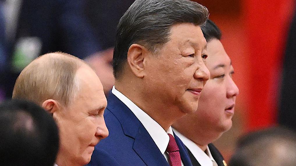 De izquierda a derecha, Vladimir Putin, Xi Jinping y Kim Jong-un.