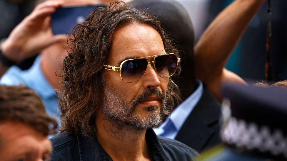 Russell Brand arrives at court for first hearing