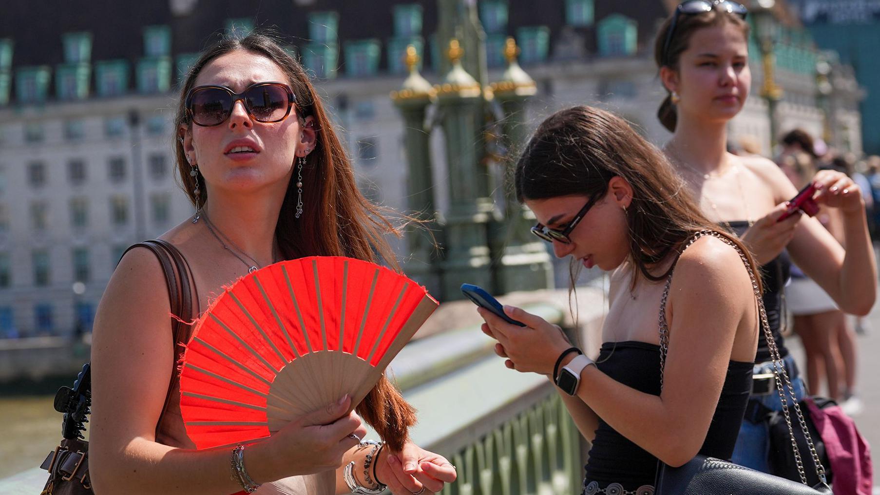 UK braces for hottest June day, as French PM says 40 have drowned in heatwave