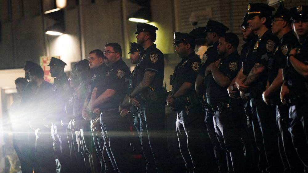 Police officer among four dead in shooting at New York City office building