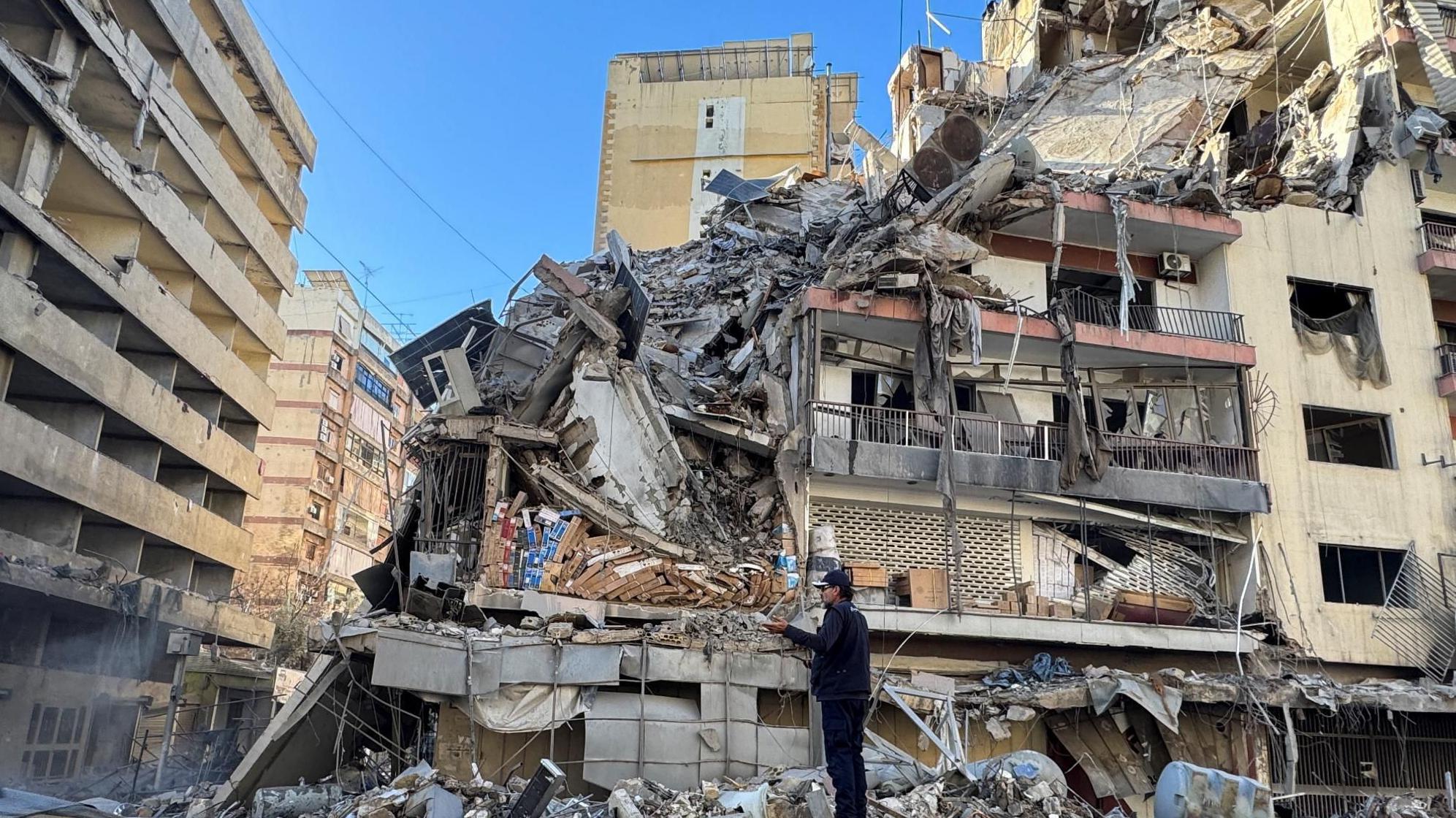 Israel and Iran launch new strikes as first UK flight bringing citizens home is delayed