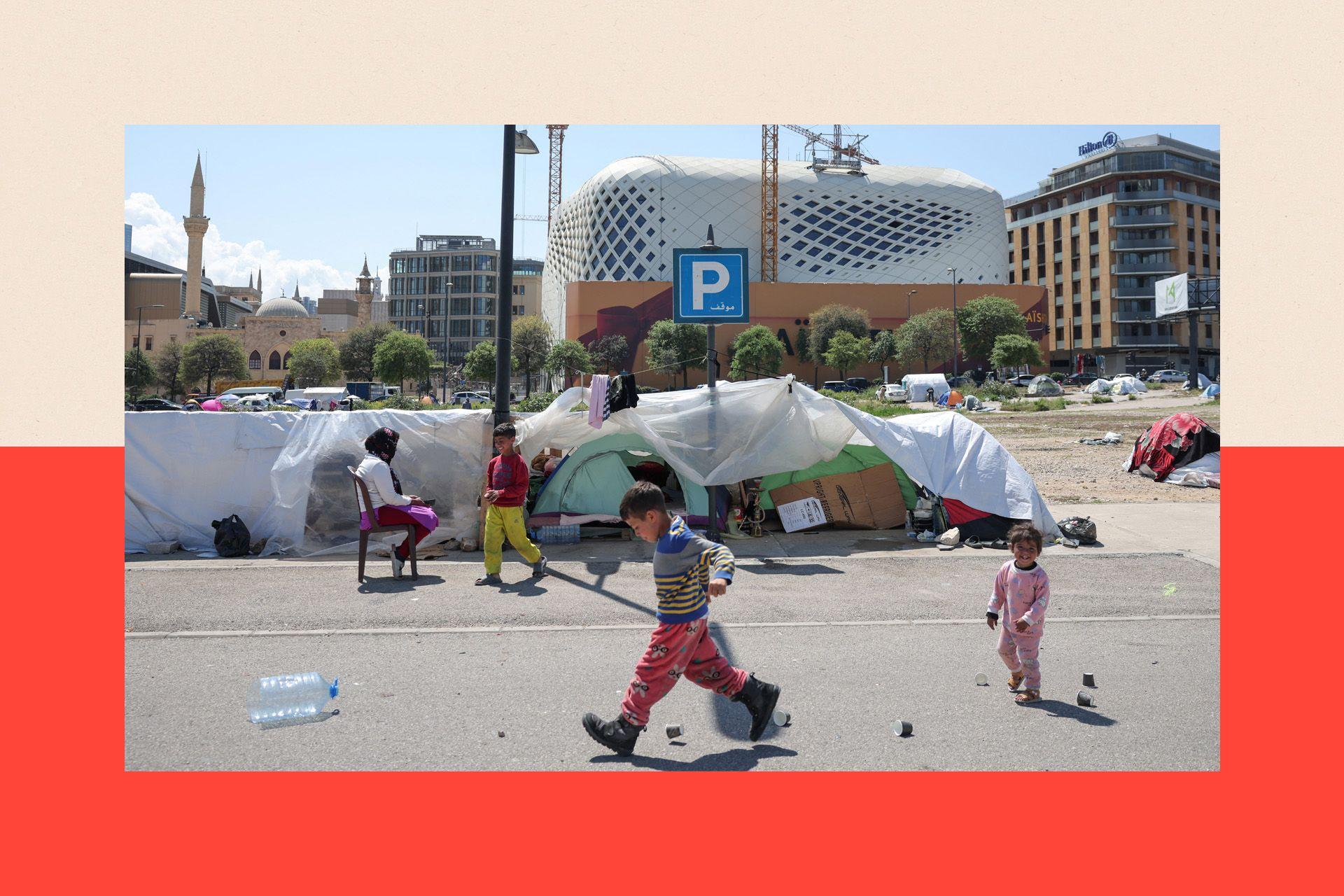Displaced children play by their tents at their makeshift encampment in Beirut, Lebanon.