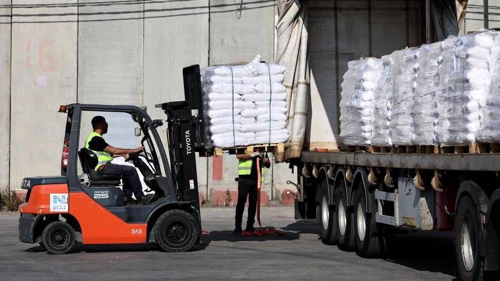 More than 100 aid trucks cross into Gaza as UN warns of race against time to reach people in need