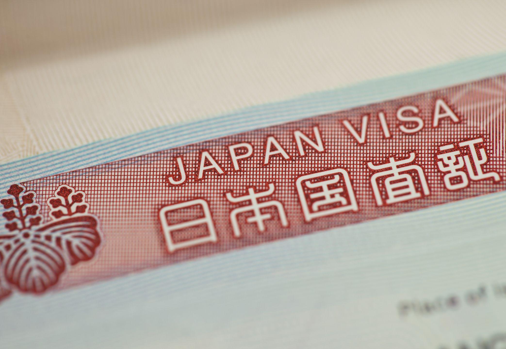 Folha de papel diz: 'Japan visa' (Visto japon&ecirc;s)
