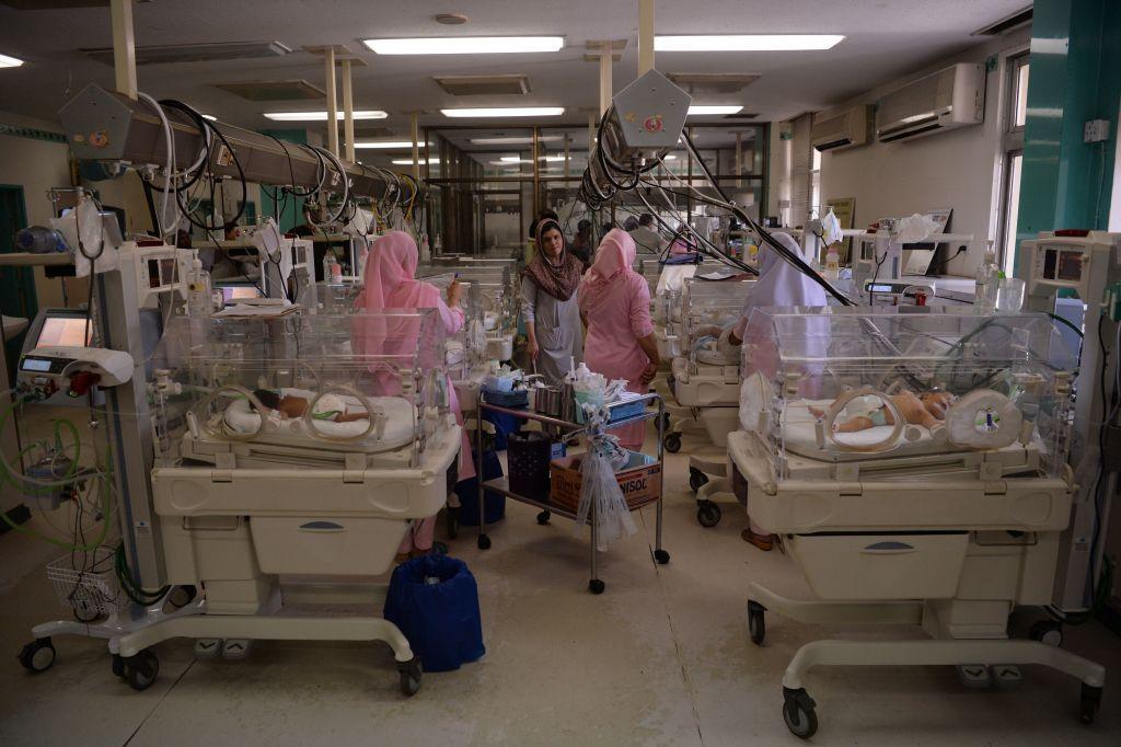 Pakistani nurses take care of newborn babies at the Neonatal intensive care unit of Pakistan Institute of Medical Sciences (PIMS) in Islamabad on February 20, 2018. In the neonatal intensive care department of an Islamabad hospital, scrawny infants struggle for survival -- victims of a vacuum in resources and education in the country with the highest newborn mortality rate in the world. 