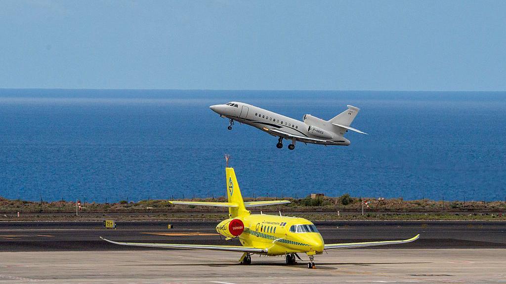 A yellow plane on the runway in Tenerife