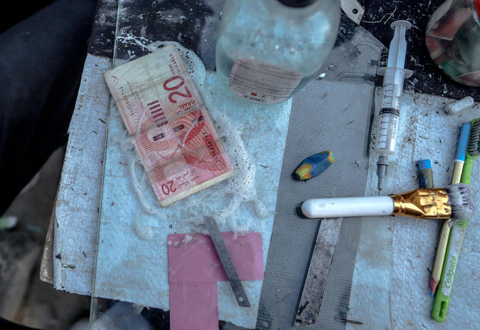 Palestinians repair old and worn-out banknotes as the enclave runs out of hard currency on June 02, 2025, in Gaza City