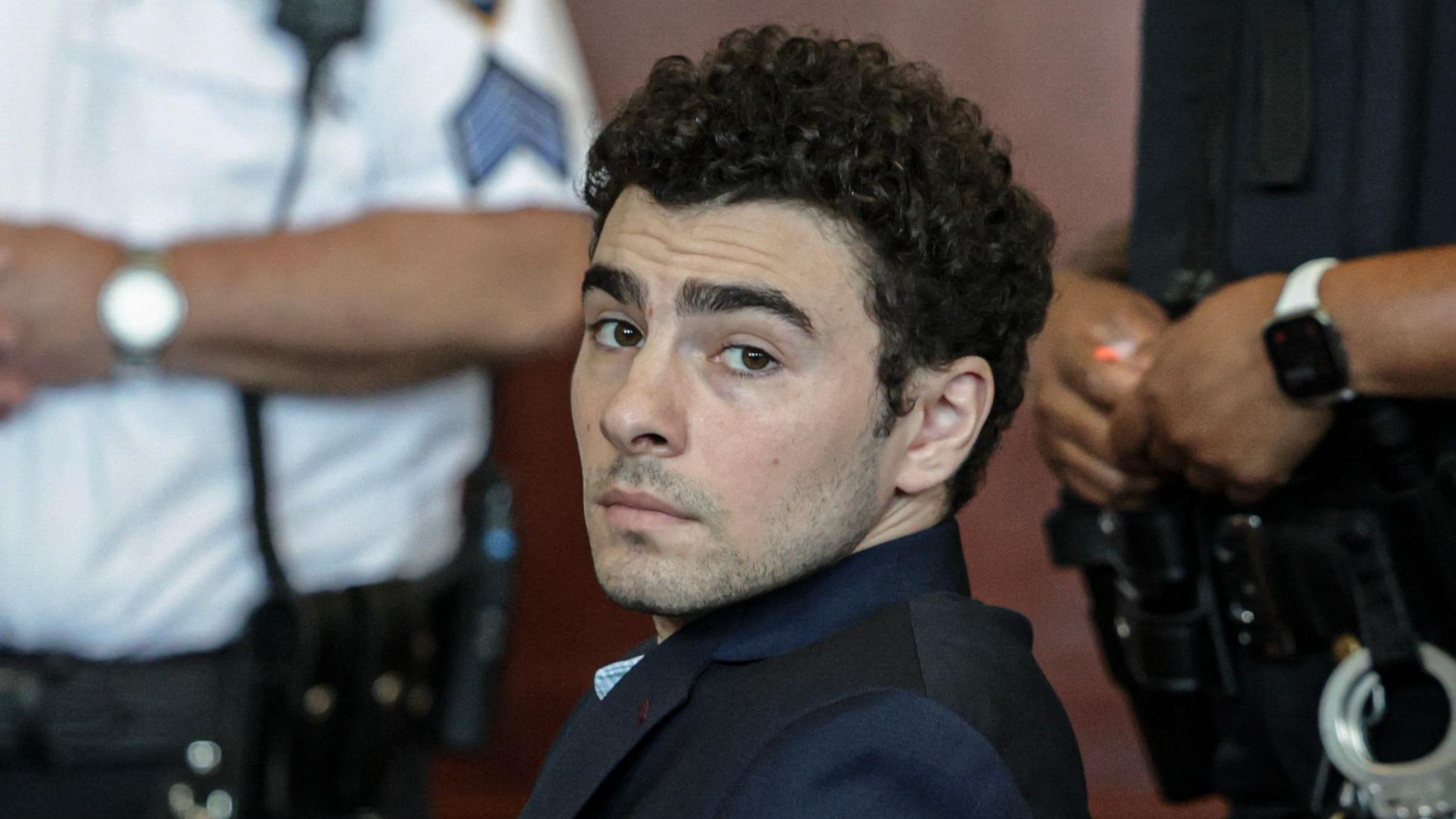 Mangione admits killing healthcare CEO and pleads guilty to federal charges
