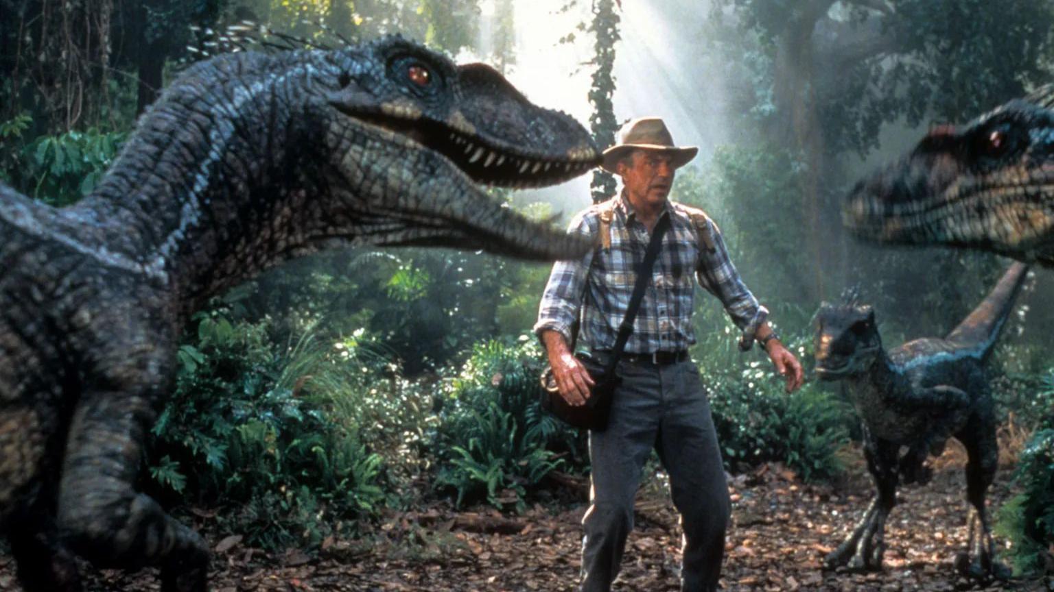 Preminuo Sem Nil, zvezda filma 'Park iz doba Jure' - fotografije njegovih uloga 9 Sem Nil okružen dinosaurusima u prirodi