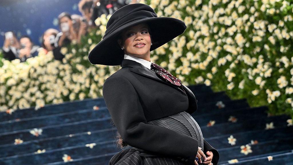 Rihanna reveals she is pregnant with third child at Met Gala
