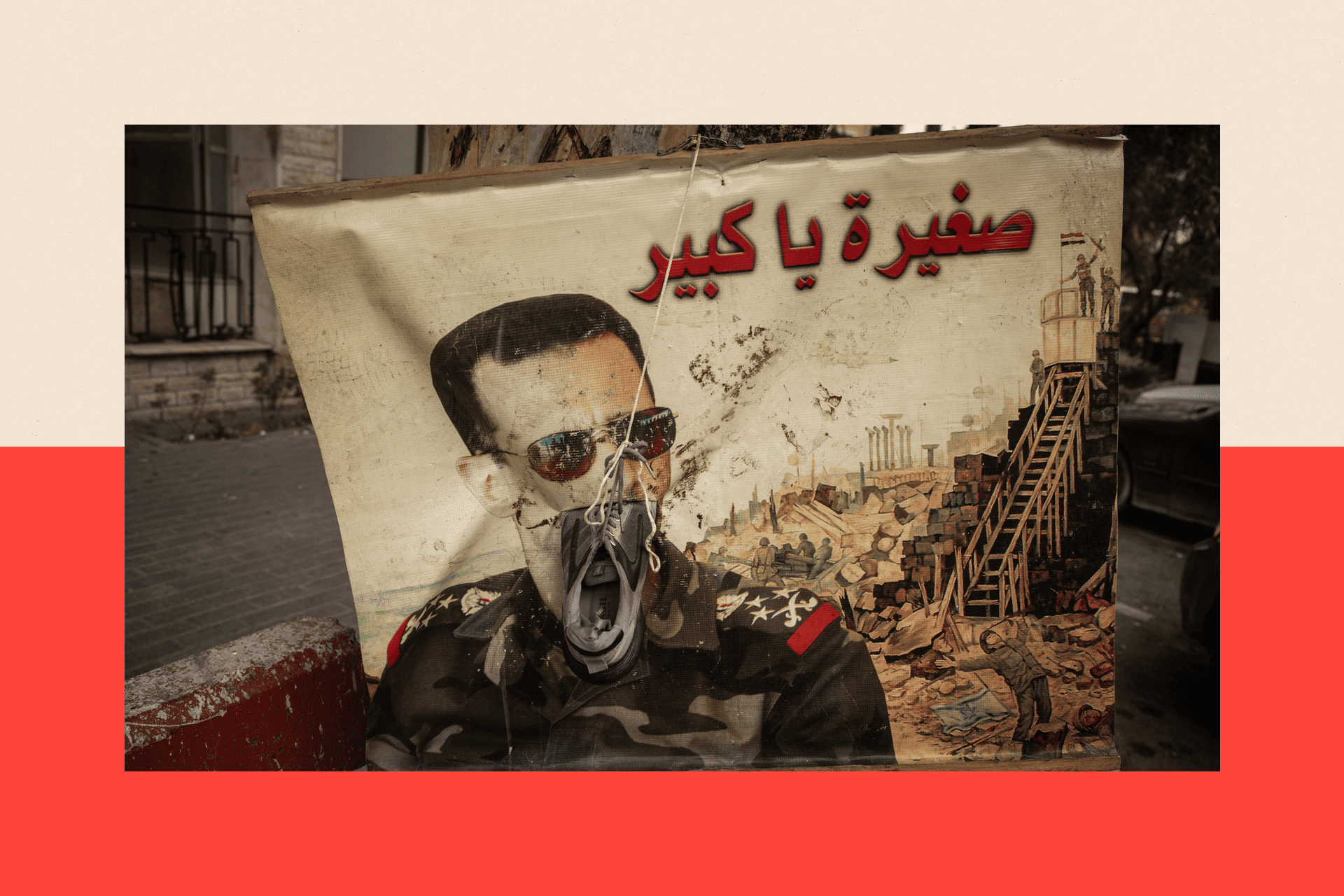 A defaced poster of Bashar al-Assad on December 22, 2024 in Damascus, Syria