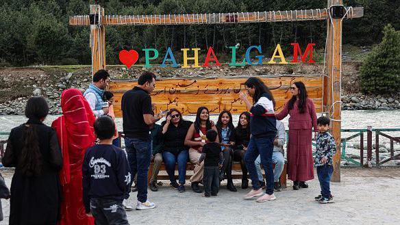 Indian tourists enjoy the area near the viewpoint ahead of the Baisaran incident anniversary in Pahalgam, Jammu and Kashmir, India, on April 21, 2026. (Photo by Nasir Kachroo/NurPhoto via Getty Images)