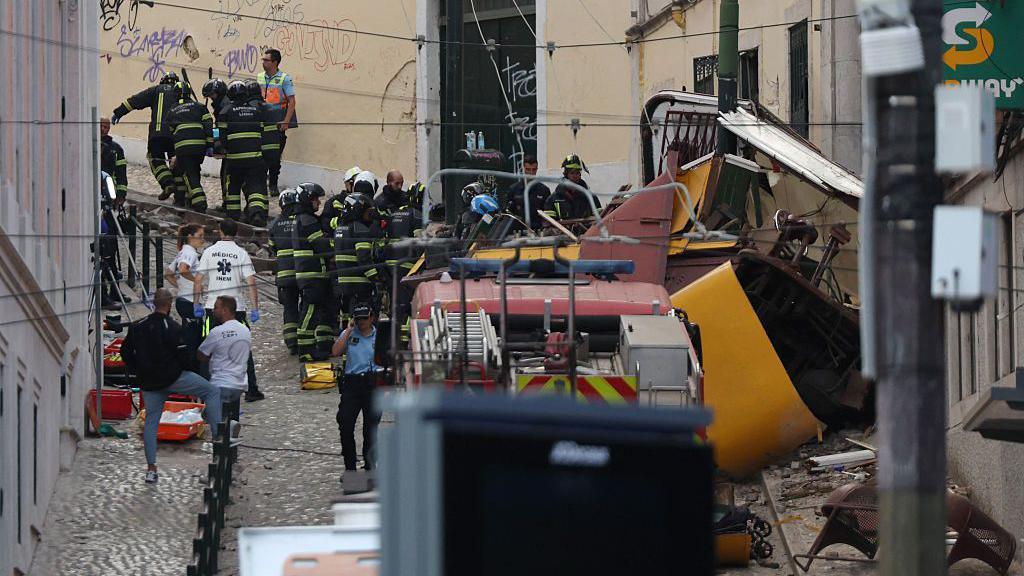 At least 15 dead after Lisbon funicular derails and hits building