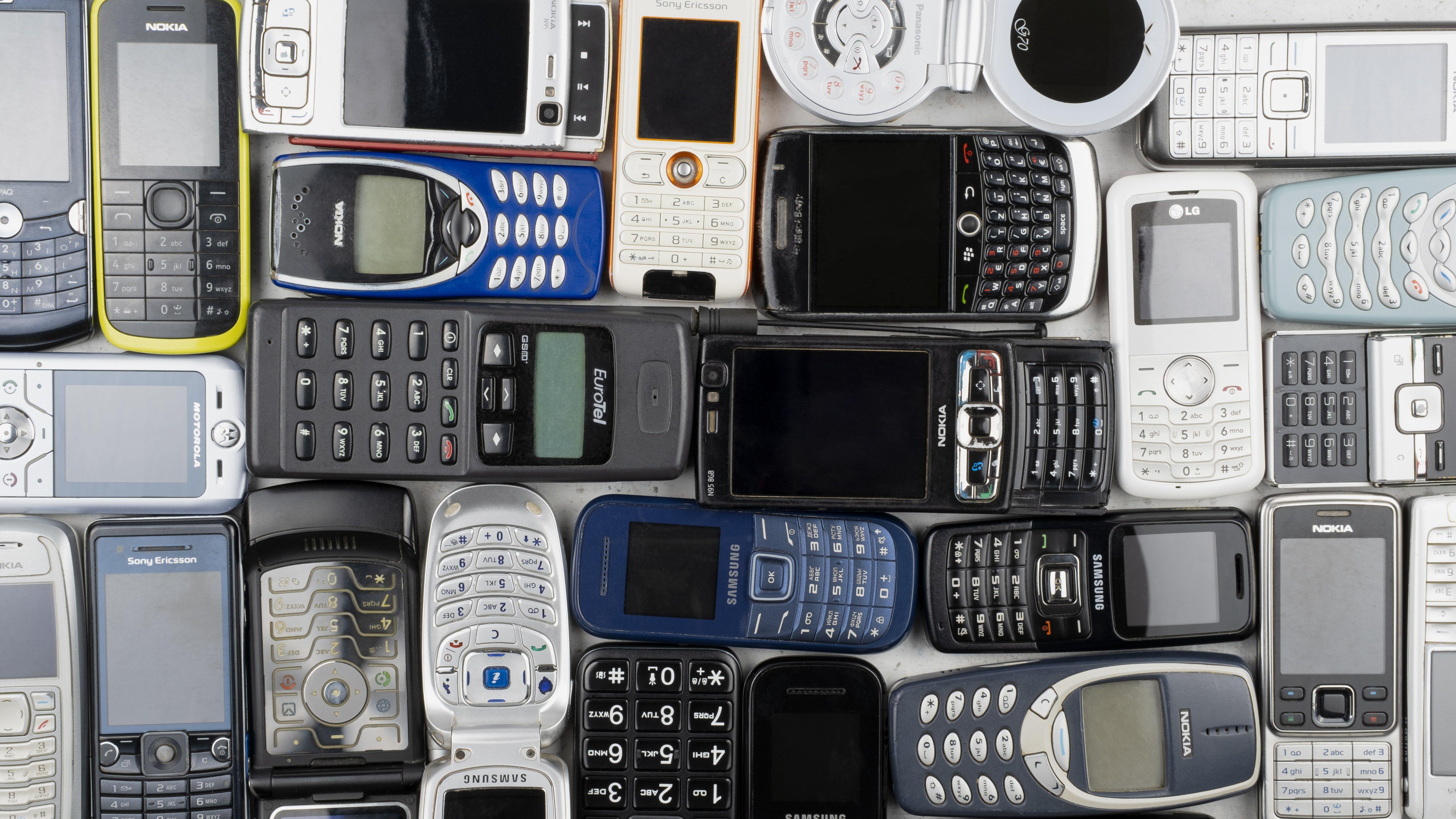 A collection of mobile phones from the early 2000s