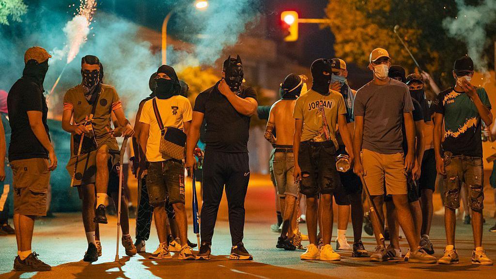 Fourteen people arrested after anti-migrant riots in southern Spain