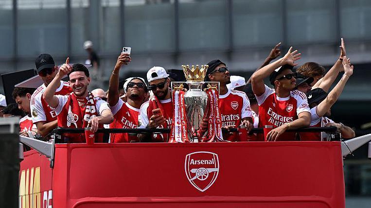 Thousands of fans watch on as Arsenal celebrate Premier League win with open-top bus parade