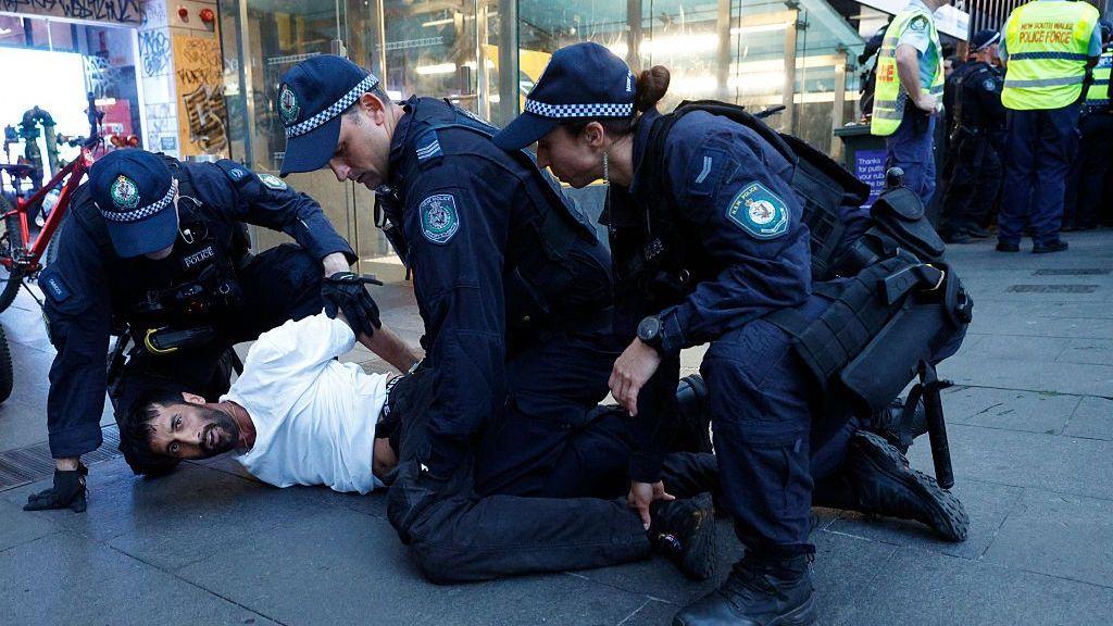 Australia police defend actions after violence at protest over Israeli president visit