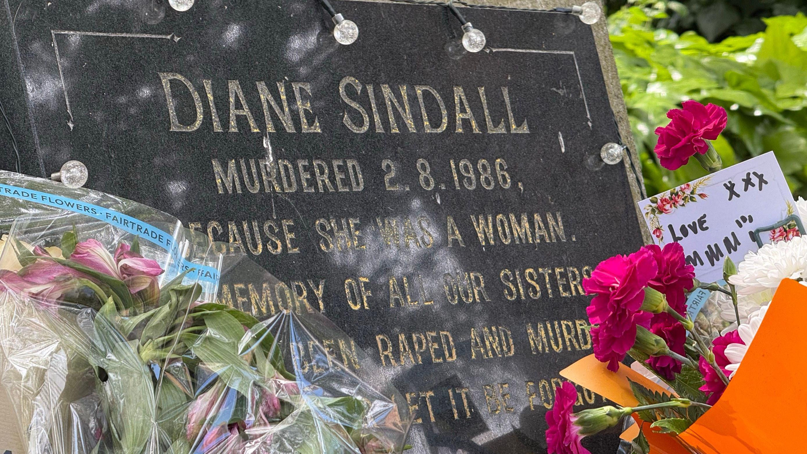 Diane Sindall memorial adorned with fresh flowers.
