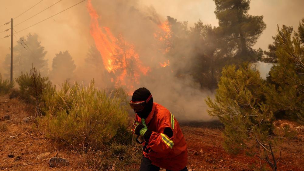 Search and rescue operation under way after two firefighting helicopters collide in Greece
