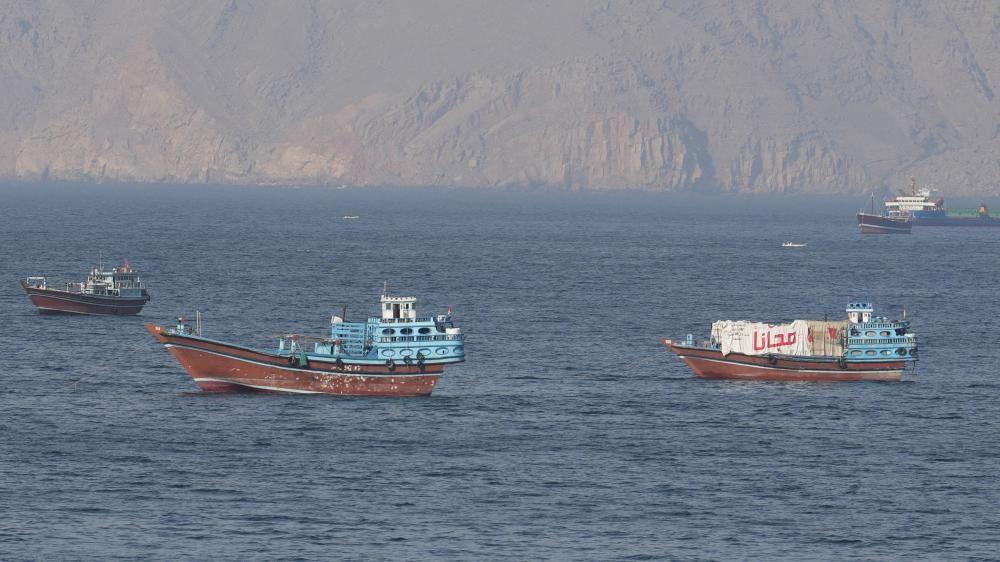 Iranian navy says Strait of Hormuz closed until US blockade lifts, as ships report attacks