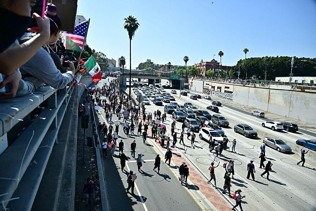 Protesters block LA freeway as Trump vows troops will protect 'law and order'