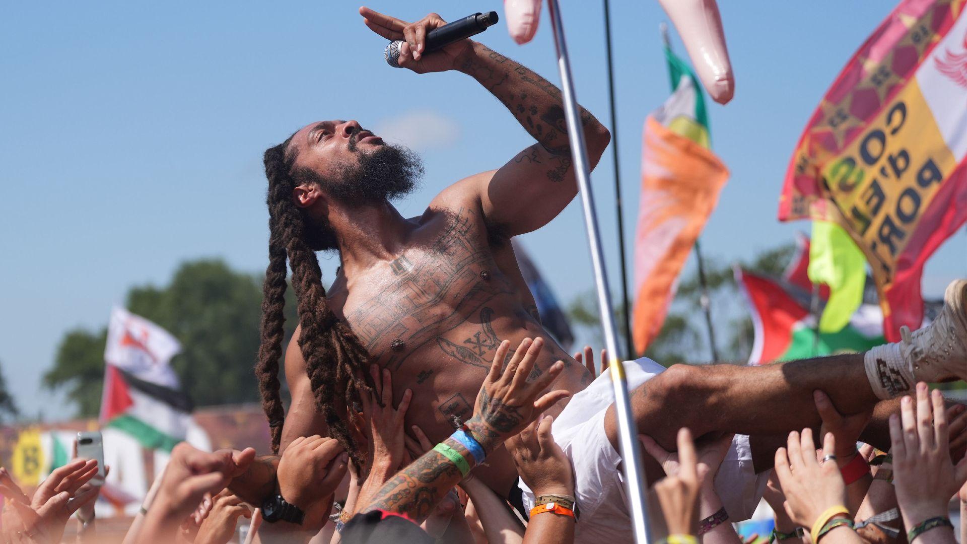 Police review footage of chants led by Glastonbury acts