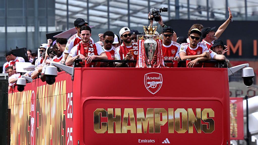 Thousands of fans watch on as Arsenal celebrates Premier League win with open-top bus parade