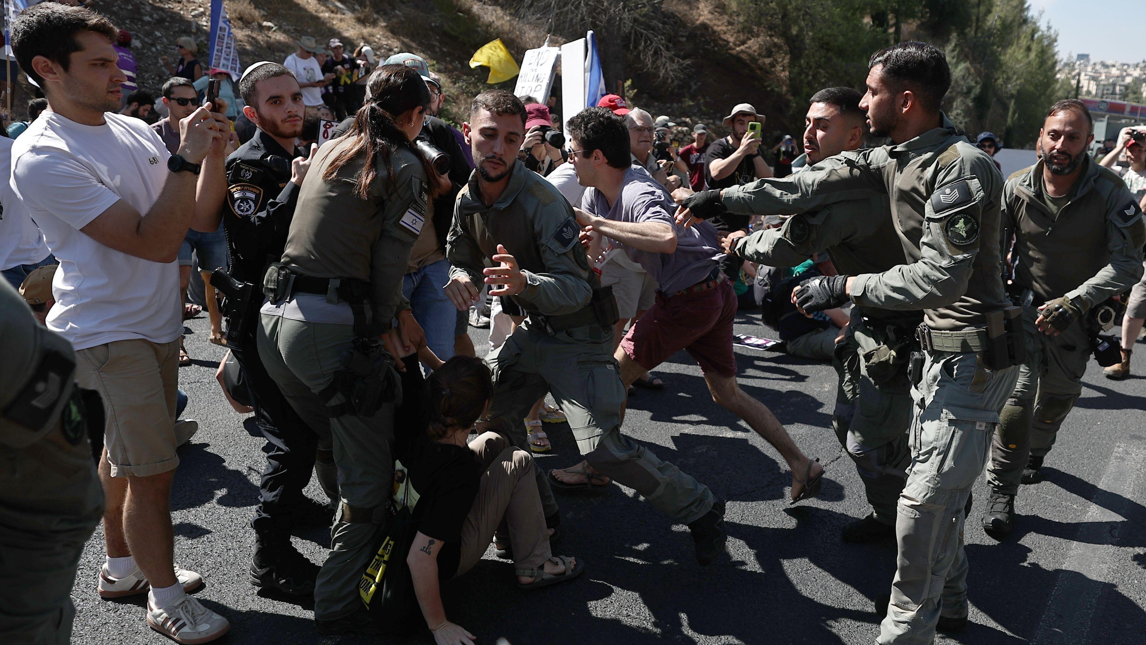 Palestinians flee IDF attacks on Gaza City as Israelis protest against occupation plan
