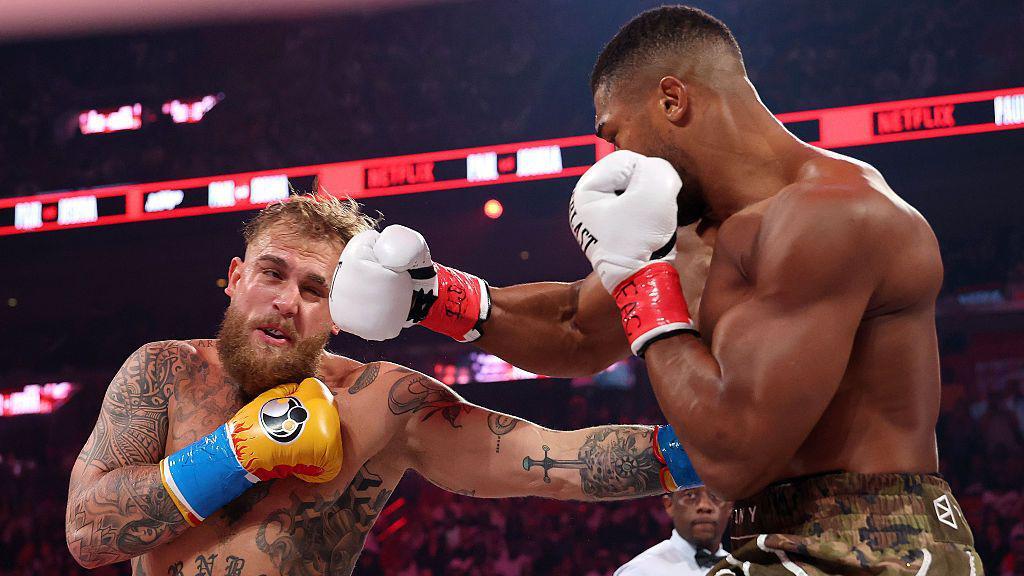 Joshua stops Paul in round six of heavyweight fight in Miami