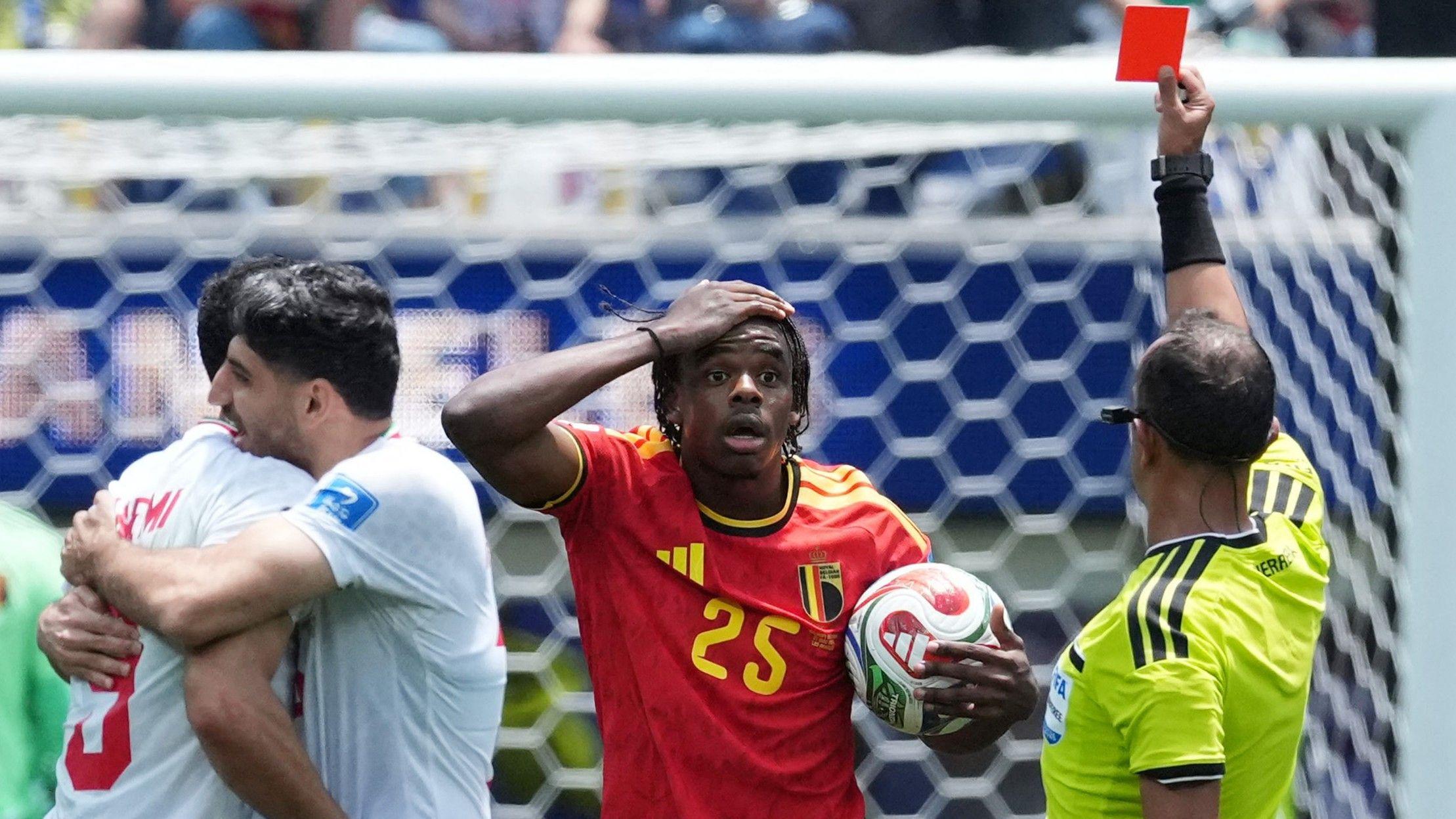 Ten-man Belgium level with Iran in closing stages