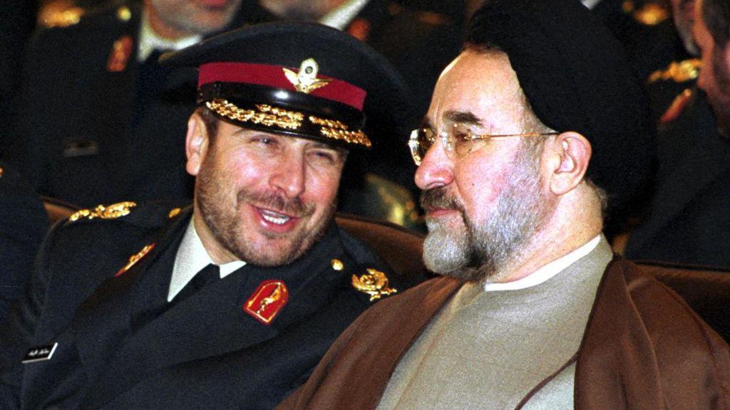 Mohammad Bagher Ghalibaf and Mohammad Khatami talking to each other.