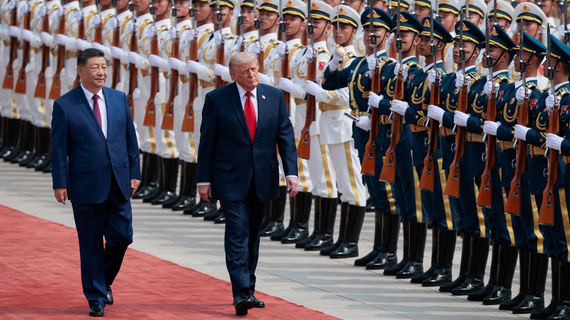 Trump and Xi shake hands on red carpet ahead of high-stakes meeting in Beijing