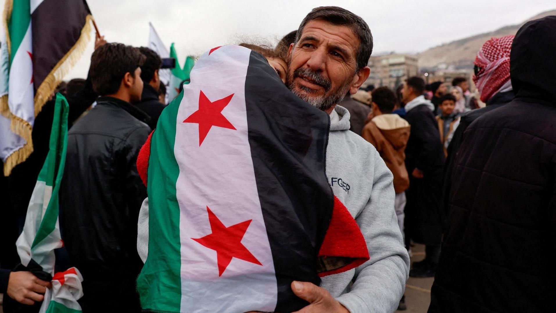 Syrians celebrate one year since Assads fall with president set to address nation