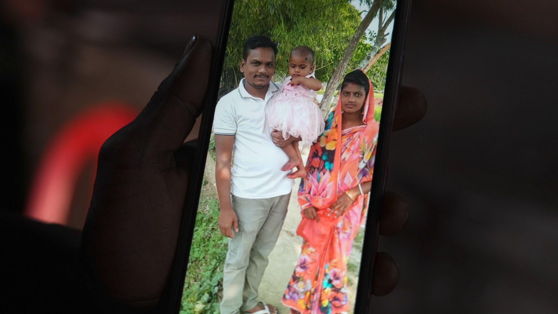 Dipu Chandra Das with his wife, Meghna and daughter Gitika pose for a family picture