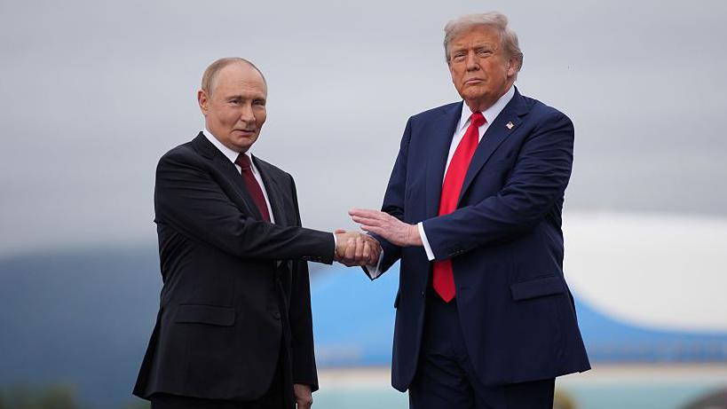 Trump and Putin greet each other with a handshake as they head for Ukraine talks in Alaska