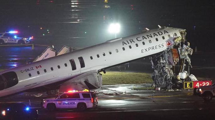 Plane and ground vehicle collide at New Yorks LaGuardia Airport