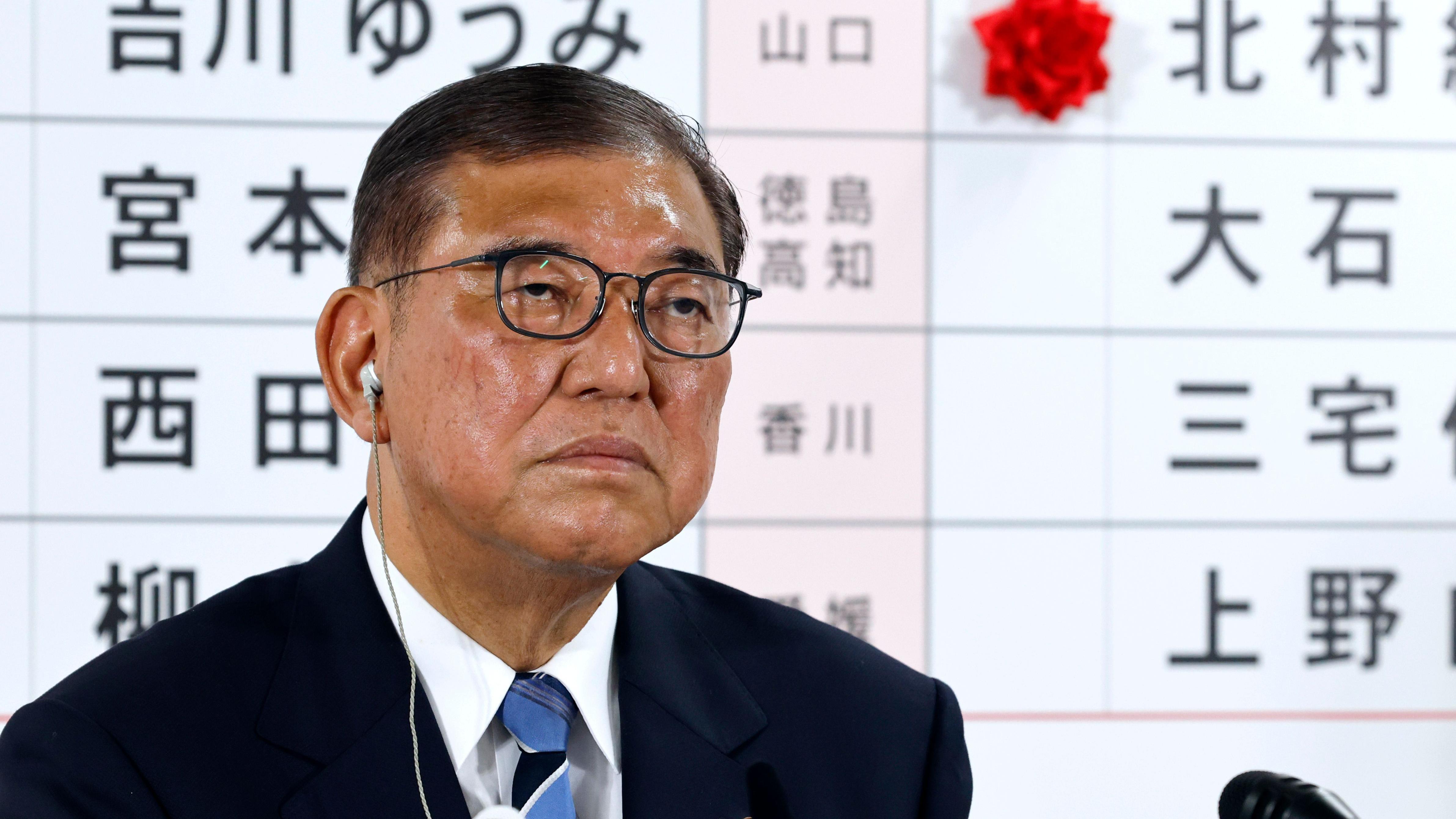 Japans PM vows to stay on despite bruising exit poll