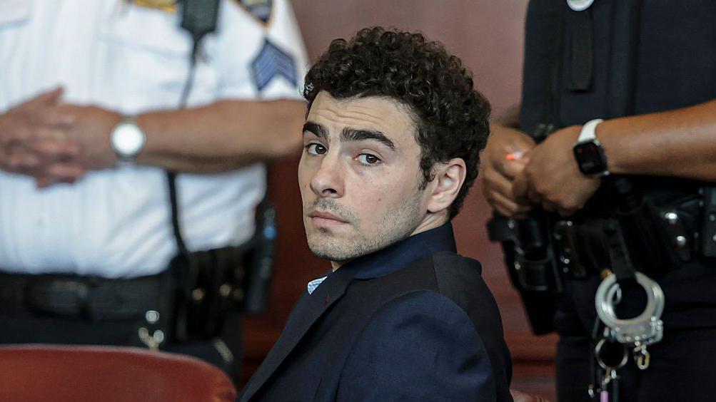 Mangione admits killing healthcare CEO and pleads guilty to federal charges