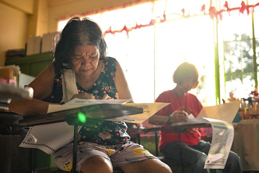 Millions vote in Philippines midterms as Marcos-Duterte feud heats up 