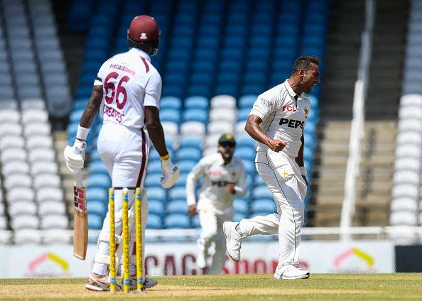 Mohammad Ali (R) of Pakistan celebrates the dismissal of Justin Greaves (L) of West Indies during the 2nd day of 1st Test match between West Indies and Pakistan at Brian Lara Cricket Academy in Tarouba