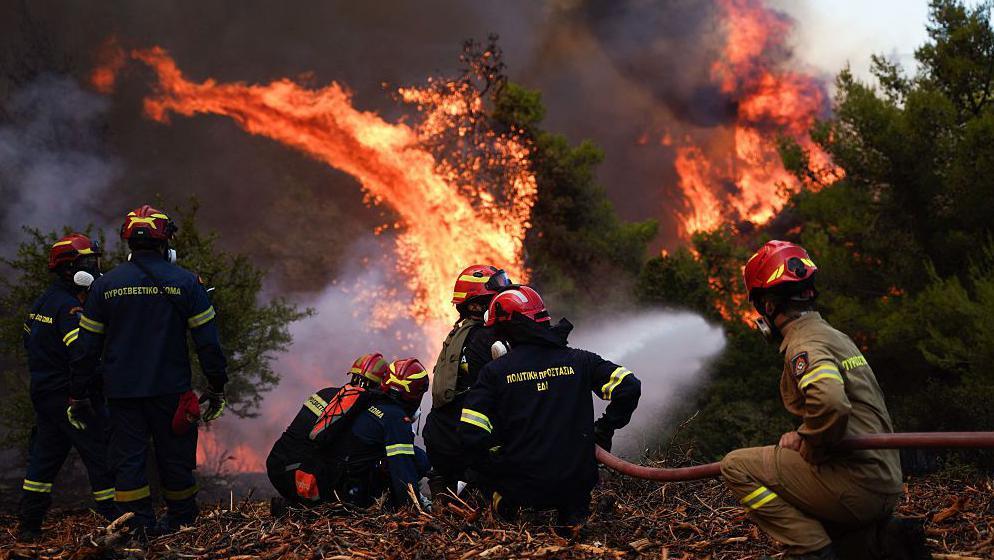 Two firefighting helicopters collide in Greece as country battles widespread blazes
