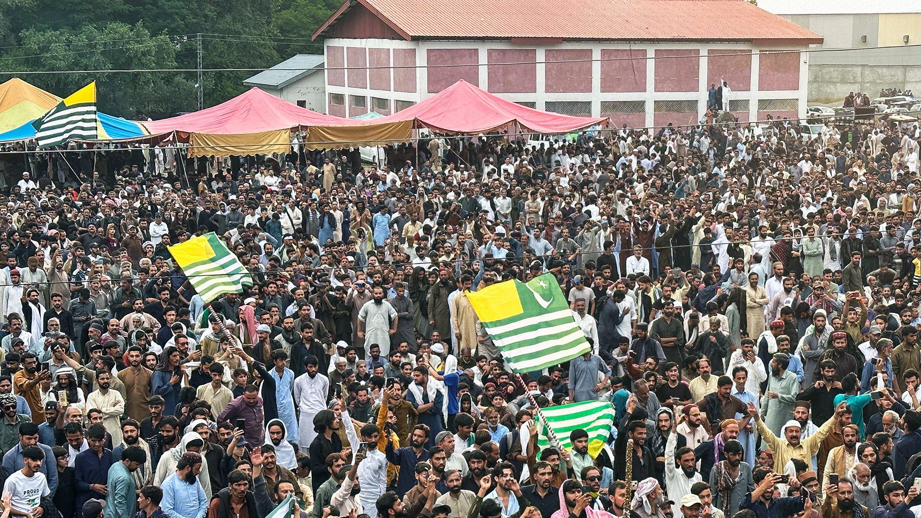 Supporters of the Joint Awami Action Committee (JAAC) gather during a week-long protest in Rawalakot, in Pakistan-administered Kashmir on June 24, 2026, following the group's ban under anti-terrorism laws by local authorities. A nearly two-week standoff between protesters and police in Pakistan-administered Kashmir has left residents grappling with food shortages, while the death toll from clashes rose to 22, according to an AFP tally on June 17. (Photo by AFP via Getty Images)