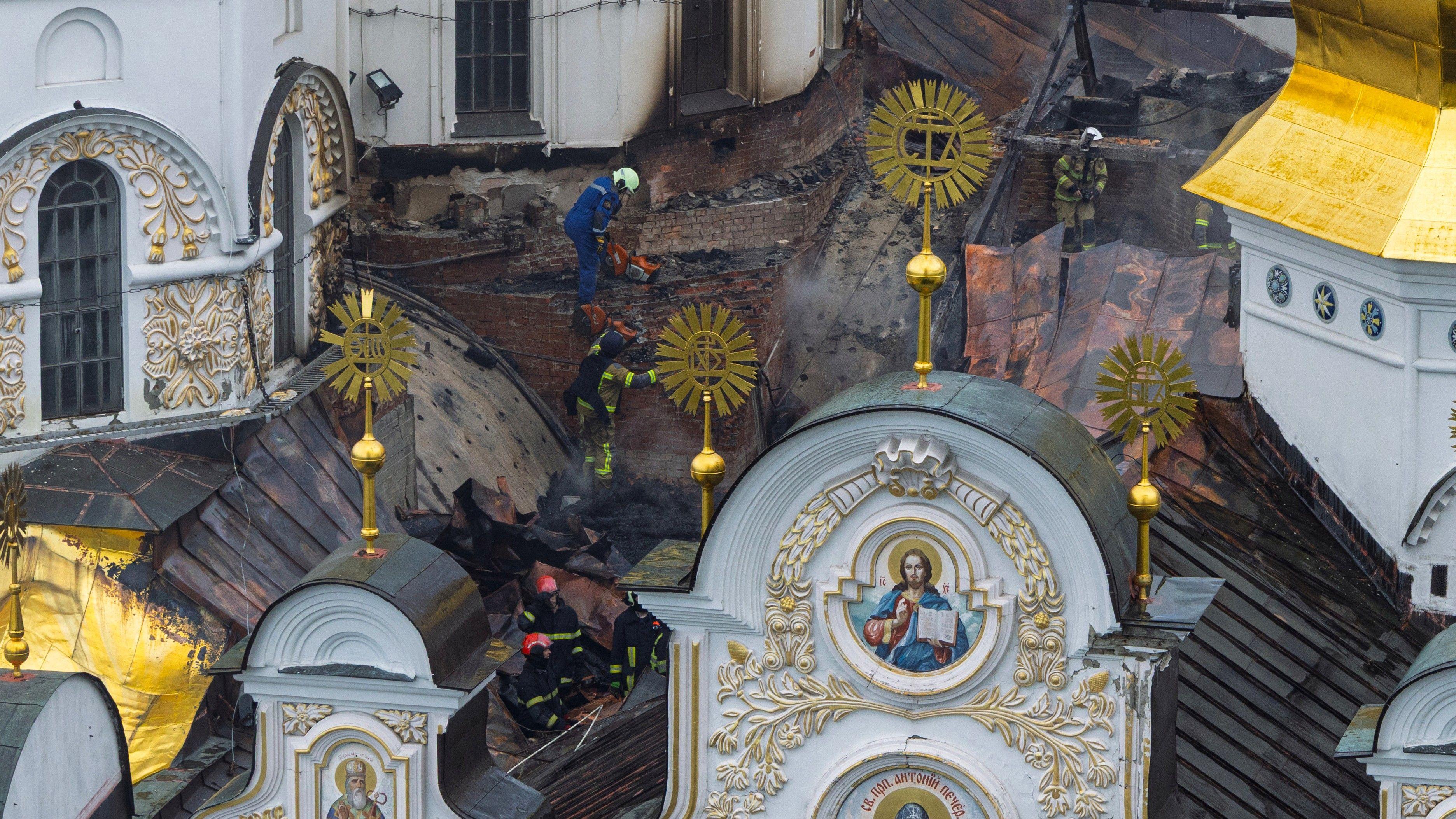 Russian strikes kill 11 and set historic cathedral in Kyiv ablaze