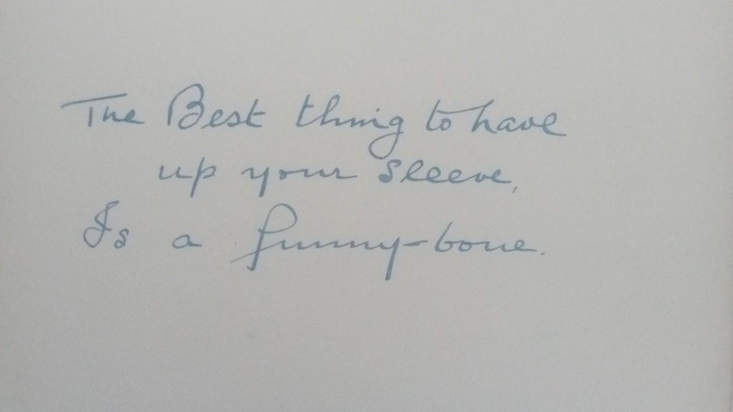 AN INSCRIPTION INSIDE A BOOK, reading 'The Best thing to have up your sleeve is a funny bone' and is dated to the 7th February 1944. 