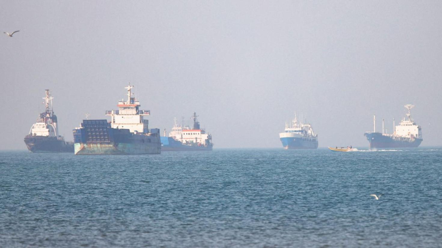 Iran warns US against being 'dragged back into quagmire' after day of attacks in Strait of Hormuz