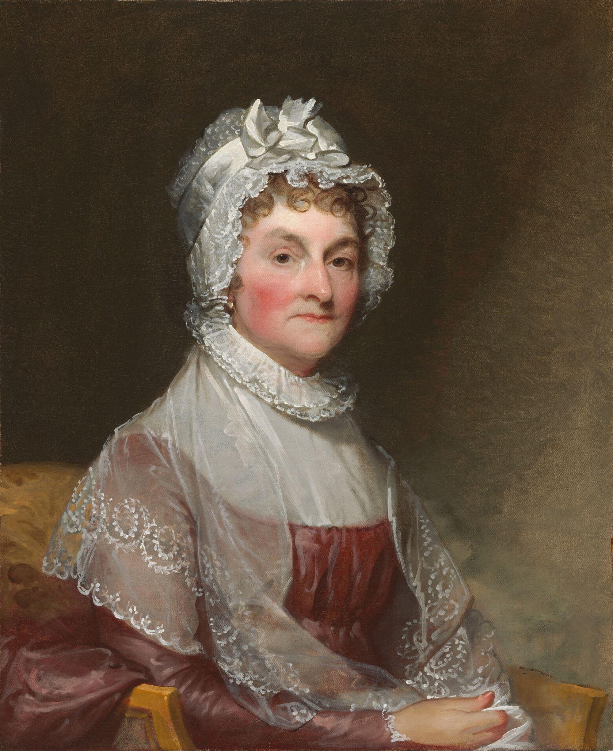 Retrato al óleo de una persona sentada con vestido y cofia de encaje, sobre un fondo oscuro.