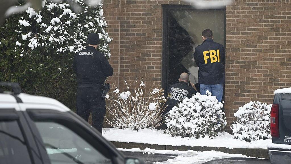 Police search for gunman in deadly Brown University shooting after releasing 'person of interest'