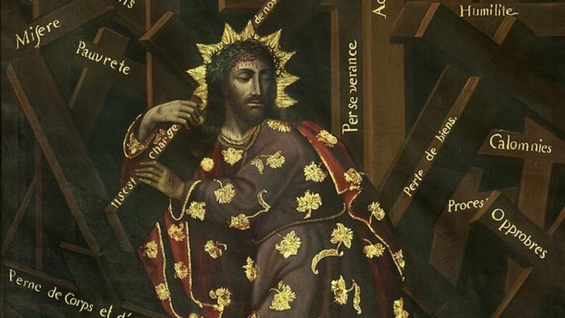 Representação de Jesus Cristo com a cruz no ombro